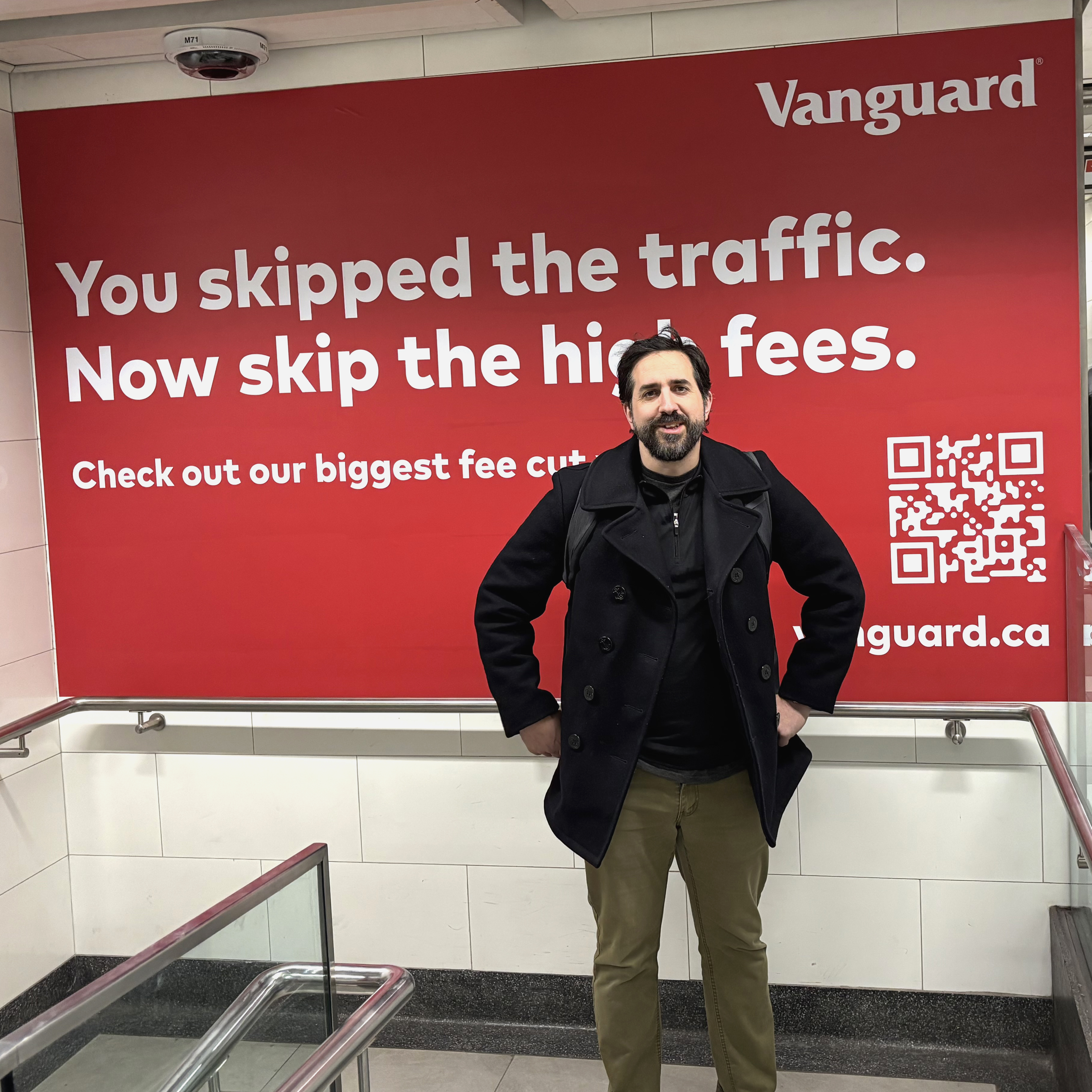an image of me standing in front of some of the Ads placed in Union Station Toronto as part of Vanguard Canada's price cut campaign.